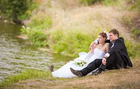 Romantic wedding couple having fun together outdoor in natureのeditorial素材