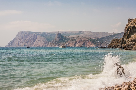 Rocky coastline with pine trees on blue sky and sea background ("Inzhir" reserve, Crimea, Ukraine)の写真素材