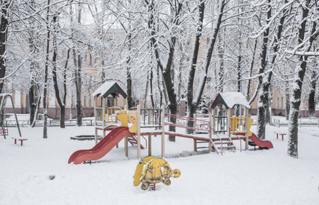 Colorful slides in the park under the snowの写真素材