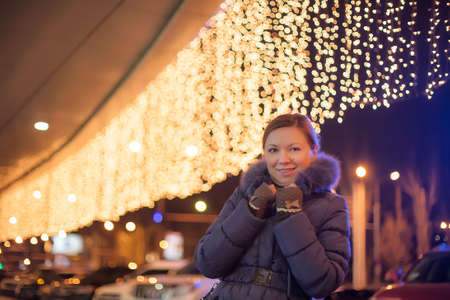 young pretty woman outdoor in christmas winterの写真素材