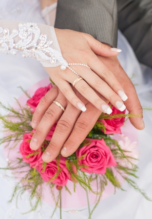 Hands and rings it is beautiful wedding bouquetの写真素材
