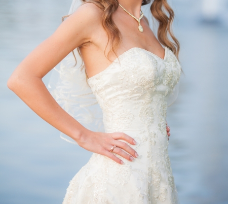 Beautiful wedding bouquet in hands of the brideの写真素材