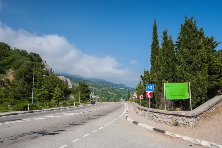 Day view of road between vineyards in mountains. (Crimea, Ukraine)の写真素材