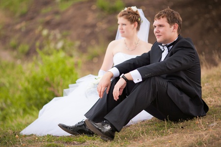 Romantic wedding couple having fun together outdoor in natureの写真素材