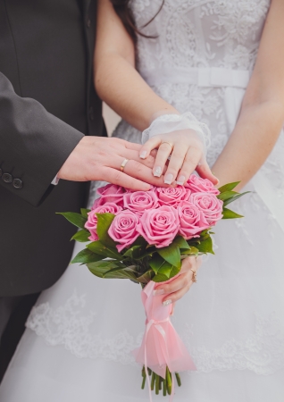 Hands and rings it is beautiful wedding bouquetの写真素材