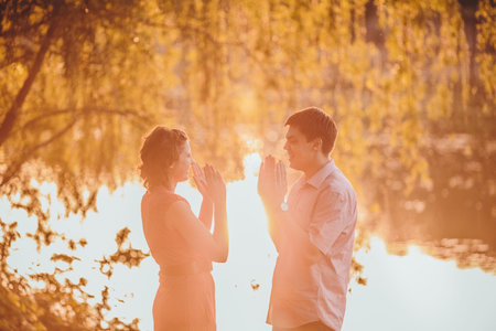 Portrait of young couple in flowering park
