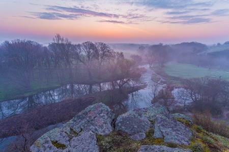 Misty morning on the river in early springの写真素材