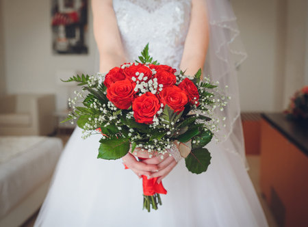 Beautiful wedding bouquet in hands of the brideの写真素材