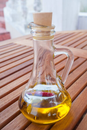 Black olives with bottle of oilの写真素材