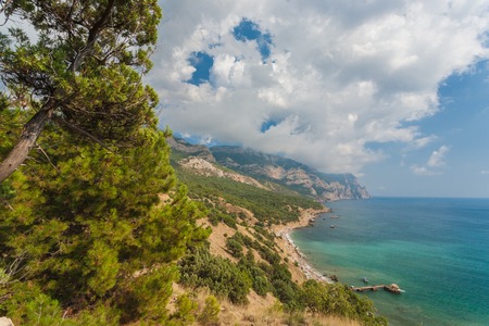 Beach between rocks and sea の写真素材
