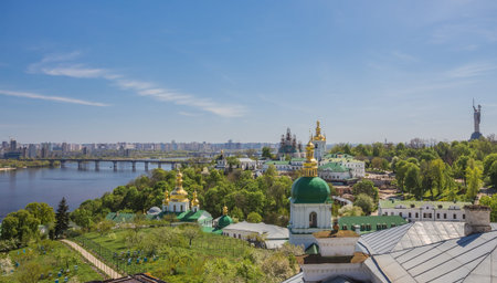 Panoramic view of Kyiv-Pechersk Lavra churches, the Dnieper river and high buildings in Kyiv, Ukraineの写真素材