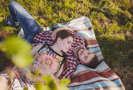 a young couple in love walking in the woodsの写真素材