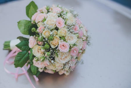 Beautiful wedding bouquet lying on the benchの写真素材