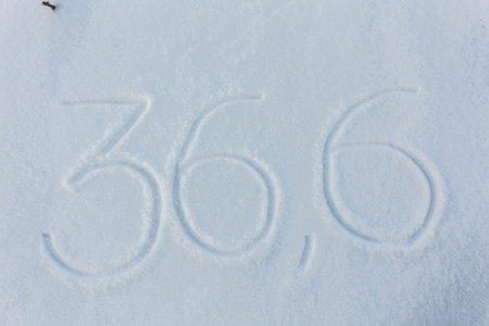 The word 36,6 draw on snow backgroundの写真素材