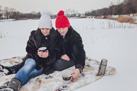 Young  happy smiling couple in love. Winterの写真素材