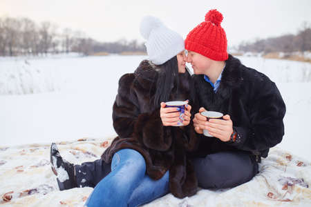 Young  happy smiling couple in love. Winterの写真素材