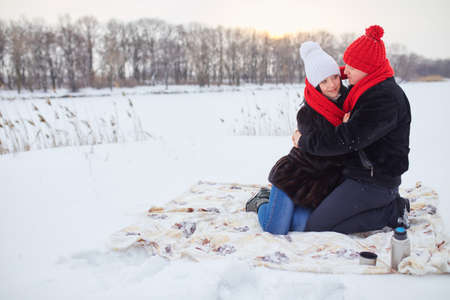 Young  happy smiling couple in love. Winterの写真素材