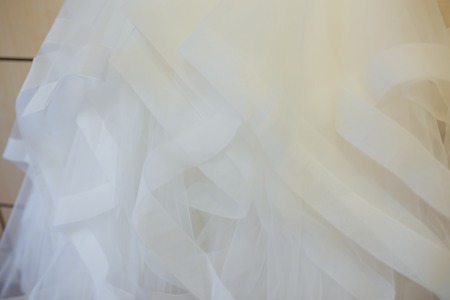 White Wedding dress hanging on a shouldersの写真素材