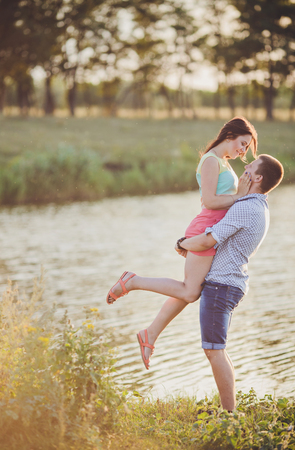 young couple in love walking in natureの写真素材