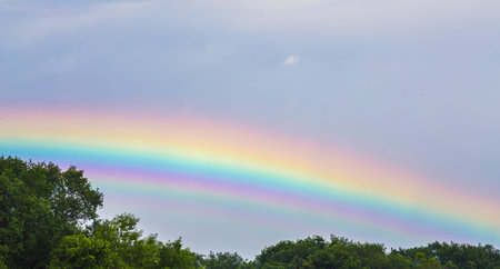 Blue sky and white cloud with sun light and rainbow