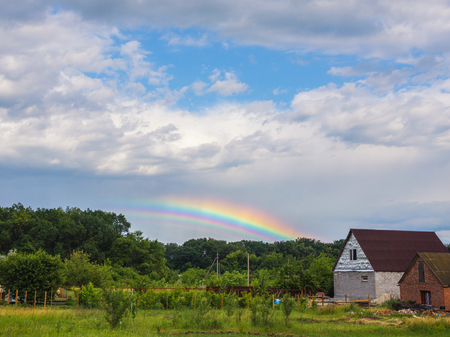 Blue sky and white cloud with sun light and rainbowの写真素材