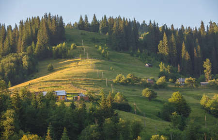 Beautiful summer landscape with village in mountainsの写真素材