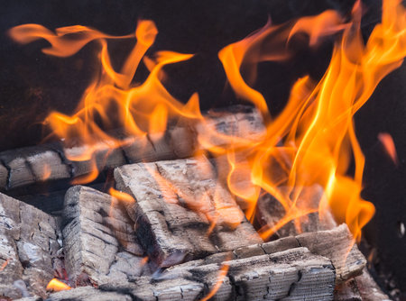 Wood burning in the fire - a square background