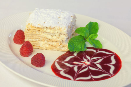 Napoleon cake with raspberries, strawberries, blueberries served for the holiday