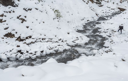 mountain river with big stones in winter timeの写真素材