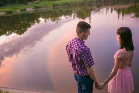 Happy couple at a lake in the countrysideの写真素材