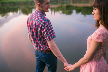 Happy couple at a lake in the countryside