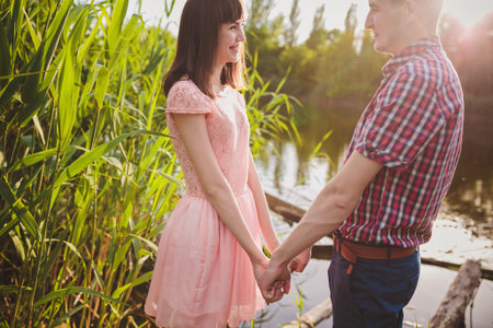 a young couple in love walking in the woodsの写真素材