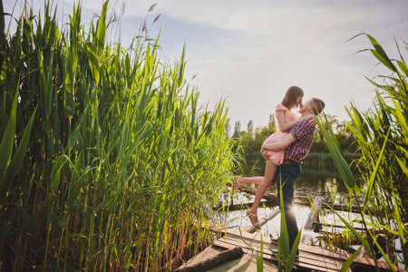 Happy couple at a lake in the countrysideの写真素材