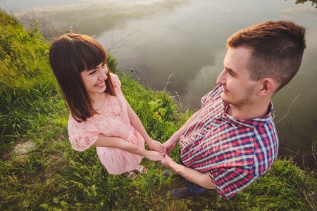 a young couple in love walking in the woodsの写真素材