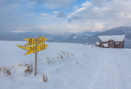 wonderful winter scenery with snow and timber cabin chalet homeの写真素材