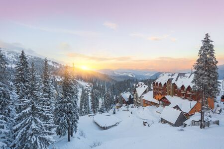Winter resort with slopes for skiing and snowboarding with houses and liftsの写真素材