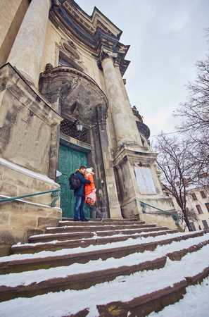 Young happy couple in love outdoors. loving man and woman on a walk in the cityの写真素材
