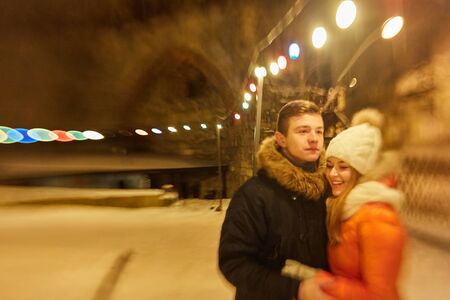 Young happy couple in love outdoors. loving man and woman on a walk in the cityの写真素材