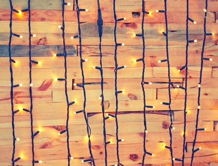 Christmas decorations on a wooden background. Filtered image with retro colorsの写真素材