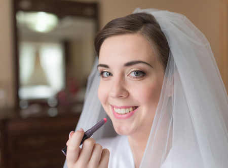 Happy bridal morning. Bride getting ready. Wedding photoの写真素材