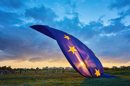 The world's largest flag of the European Union in the sky, during sunsetの写真素材