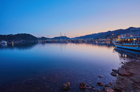 Small port of Kekova with moored yachts during sunset, Turkeyの写真素材
