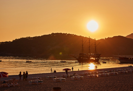 Silhouette of mountains and yachts at sunset, Oludeniz Turkeyの写真素材