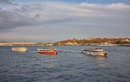 Bosphorus strait with ferry boats on the sunset in Istanbul, Turkeyの写真素材