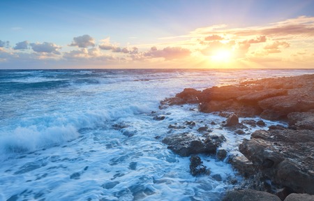 Sunset on the shores of the Mediterranean Sea off the coast of Cyprusの写真素材