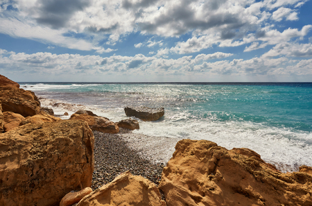 Beautiful wild beach with clear turquoise water and waves. Lara beach, Cyprus.の写真素材