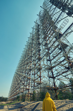 Telecommunication radio center in Pripyat, Chernobyl area known as the Arc or Duga and so called Russian woodpecker with blue sky and clouds on backgroundの写真素材