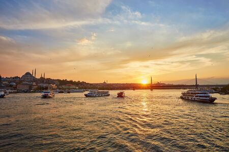Bosphorus strait with ferry boats on the sunset in Istanbul, Turkeyの写真素材