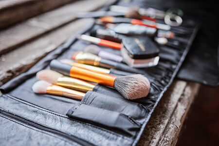 Case makeup artist. A set of brushes, powder, foundation. Tools make-up artist in a boxの写真素材