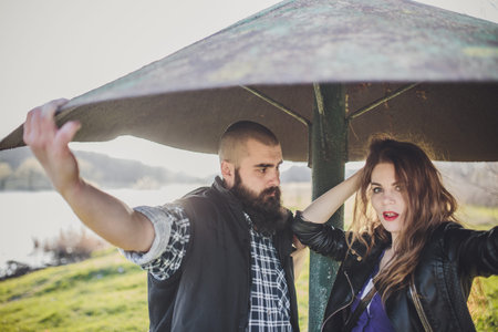 A girl and a guy are walking in the park. Portrait of a couple, a love story.Happy smiling, loving...